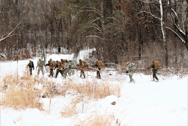 Students in Cold-Weather Operations Course Class 21-02 practice snowshoeing and pulling ahkio sleds with gear as teams Jan. 7, 2021, near Whitetail Ridge Ski Area in Pine View Recreation Area at Fort McCoy, Wis. The course covers a variety of...