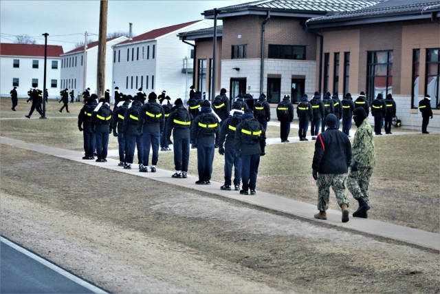 U.S. Navy recruits walk on the cantonment area Dec. 15, 2020, at Fort McCoy, Wis. The Navy’s Recruit Training Command (RTC) of Great Lakes, Ill., worked with the Army at Fort McCoy so the post could serve as a restriction-of-movement (ROM) site...