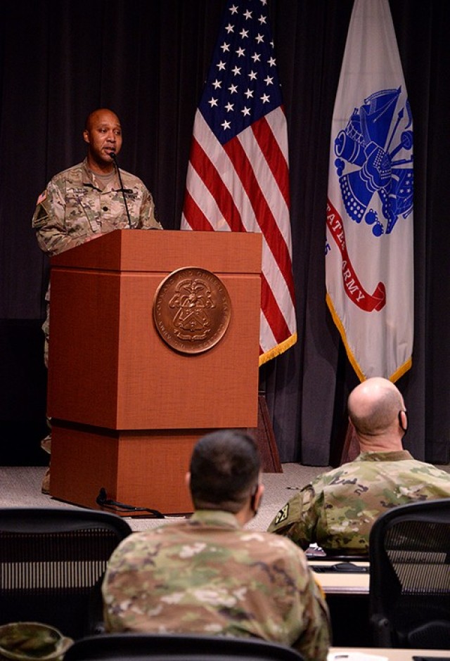 Guest speaker Lt. Col. Joel Elston, Combined Arms Center G-6 officer in charge, speaks to a small socially distanced and masked audience in DePuy Auditorium and a larger audience via Facebook during the Martin Luther King Jr. Day observance Jan....