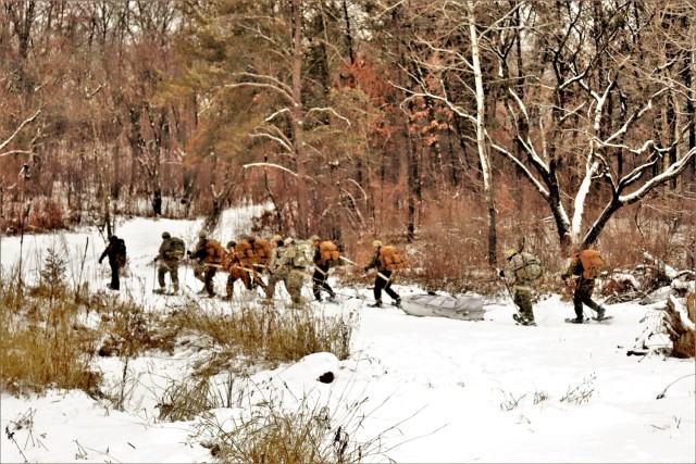 Students in Cold-Weather Operations Course Class 21-02 practice snowshoeing and pulling ahkio sleds with gear as teams Jan. 7, 2021, near Whitetail Ridge Ski Area in Pine View Recreation Area at Fort McCoy, Wis. The course covers a variety of...