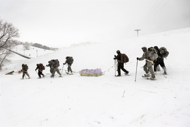 Students in Cold-Weather Operations Course Class 21-02 practice snowshoeing and pulling ahkio sleds with gear as teams Jan. 7, 2021, near Whitetail Ridge Ski Area in Pine View Recreation Area at Fort McCoy, Wis. The course covers a variety of...