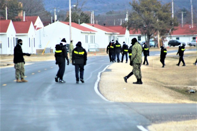 U.S. Navy recruits walk on the cantonment area Dec. 15, 2020, at Fort McCoy, Wis. The Navy’s Recruit Training Command (RTC) of Great Lakes, Ill., worked with the Army at Fort McCoy so the post could serve as a restriction-of-movement (ROM) site...