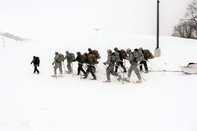 Students in Cold-Weather Operations Course Class 21-01 practice snowshoeing and pulling ahkio sleds with gear as teams Jan. 7, 2021, near Whitetail Ridge Ski Area in Pine View Recreation Area at Fort McCoy, Wis. The course covers a variety of...