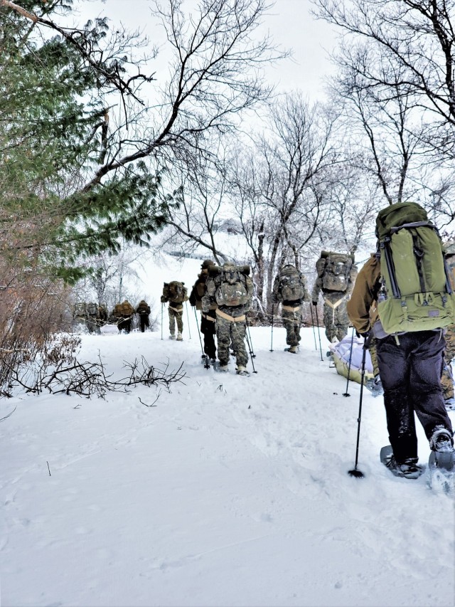 Students in Cold-Weather Operations Course Class 21-01 practice snowshoeing and pulling ahkio sleds with gear as teams Jan. 7, 2021, near Whitetail Ridge Ski Area in Pine View Recreation Area at Fort McCoy, Wis. The course covers a variety of...