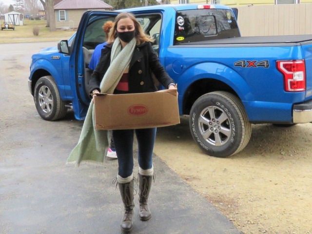 Fort McCoy, Wis., personnel and Soldiers with Headquarters and Headquarters Company (HHC), Fort McCoy Garrison, are shown after they traveled to Couleecap Monroe County Food Pantry in Sparta, Wis., on Dec. 21, 2020, for the third and final...