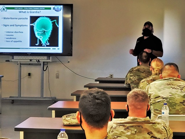 Instructor Hunter Heard teaches a class as part of the Fort McCoy Cold-Weather Operations Course on Dec. 4, 2020, at Fort McCoy, Wis. This was the first day for class 21-01 to be in session. The course is coordinated by the Fort McCoy Directorate of Plans, Training, Mobilization and Security to teach service members better skills to operate in cold weather. (U.S. Army Photos by Scott T. Sturkol, Public Affairs Office, Fort McCoy, Wis.)