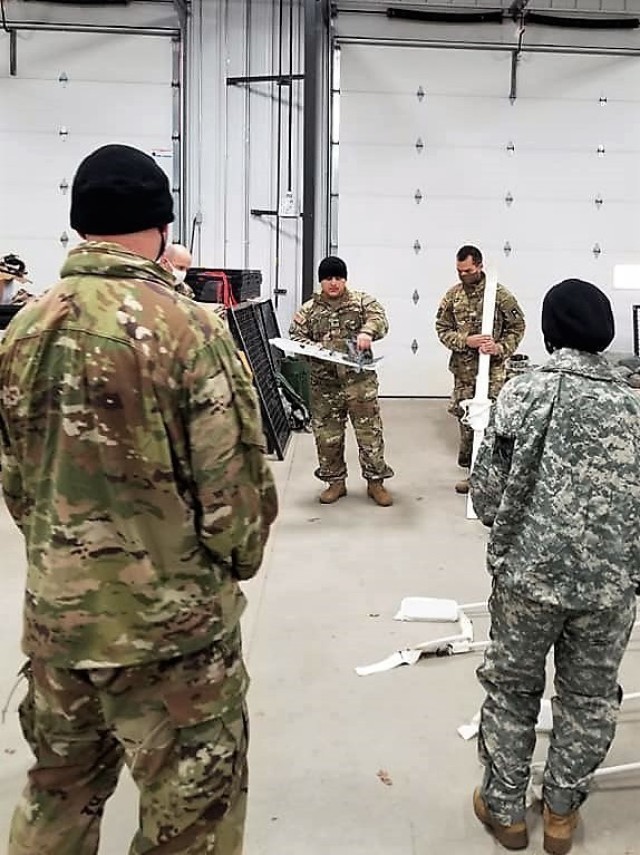 Soldiers with the 1st Battalion, 310th Brigade Engineer Battalion participate in training Dec. 9, 2020, at Fort McCoy, Wis. The training was foundational day training for the unit to focus on multiple subjects including cold-weather operations....