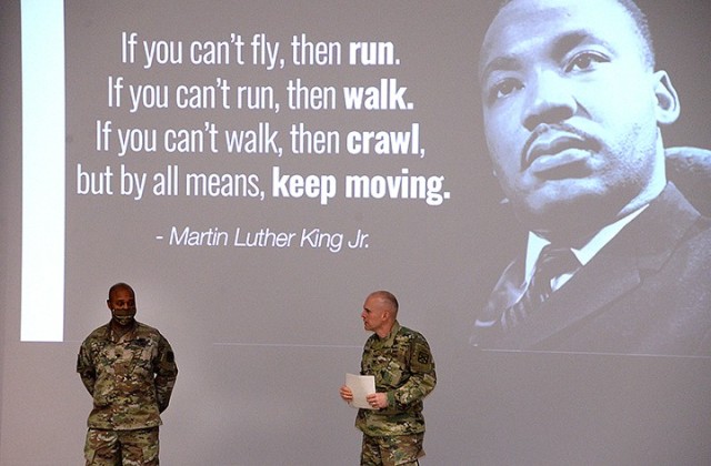 Combined Arms Center Chief of Staff Col. Thomas Bolen, right, thanks guest speaker Lt. Col. Joel Elston, CAC G-6 officer in charge, for his remarks at the Martin Luther King Jr. Day observance Jan. 12 in DePuy Auditorium. Photo by Prudence...