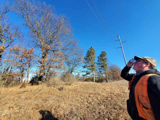 Forestry Technician Nick Randall uses a clinometer to measure the height of a tree while working on a forestry survey on the cantonment area Dec. 4, 2020, at Fort McCoy, Wis. Parry works with the Forestry Office of the Directorate of Public Works...