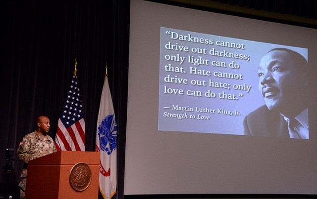 Guest speaker Lt. Col. Joel Elston, Combined Arms Center G-6 officer in charge, speaks to a small socially distanced and masked audience in DePuy Auditorium and a larger audience via Facebook during the Martin Luther King Jr. Day observance Jan....