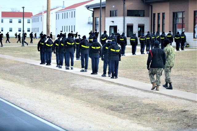 U.S. Navy recruits walk on the cantonment area Dec. 15, 2020, at Fort McCoy, Wis. The Navy’s Recruit Training Command (RTC) of Great Lakes, Ill., worked with the Army at Fort McCoy so the post could serve as a restriction-of-movement (ROM) site...