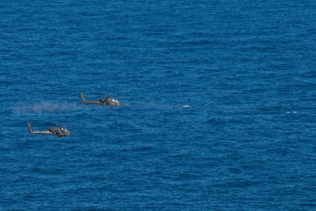 U.S. Army AH-64E attack helicopters assigned to 1st Battalion, 101st Combat Aviation Brigade, 101st Airborne Division (Air Assault) fire 2.75-inch rockets at a target in the Aegean Sea in Greece, Jan. 14, 2021. The helicopters were taking part in...
