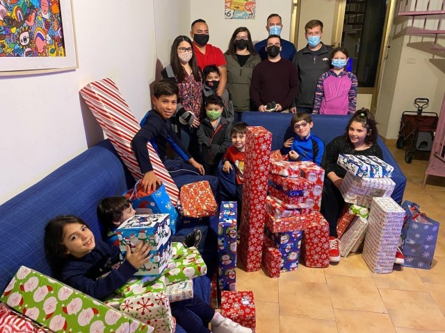 Soldiers from the Joint Tactical Ground Station-Italy at Naval Air Station Sigonella, Sicily, give more than 50 gifts to local Italian children at the Alba Chiara Orphanage in Acireale, Dec. 21, 2020, as part of an annual detachment toy drive...
