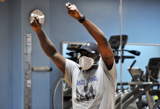 Rodney Holloway, Nightclub Cardio fitness instructor, leads his fitness class at the Yano Fitness Center, Camp Zama, Japan, Jan. 16.