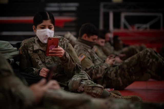 Pvt. Karla Mares uses her smartphone at Fort Sill, Okla., April 14, 2020. Soldiers living in barracks and Army housing will be able to place and track maintenance orders using the new Army Maintenance Application, or ArMA, from the convenience of...