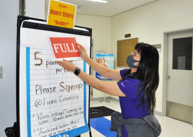 Mira Kawai, a recreation specialist, marks Rodney Holloway’s Nightclub Cardio fitness class full at the Yano Fitness Center, Camp Zama, Japan, Jan. 14. Limited to five participants due to COVID-19 restrictions, the class often results in people...