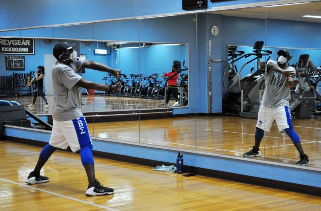 Rodney Holloway, Nightclub Cardio fitness instructor, leads his fitness class at the Yano Fitness Center, Camp Zama, Japan, Jan. 16.