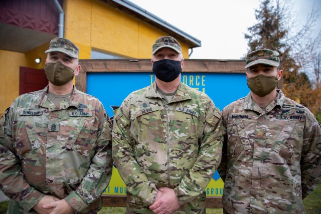 Command Sgt. Maj. Douglas Danielson, Sgt. Maj. Michael Alvis, and Maj. Douglas McGinnis pose for a photo at Combat Training Center-Yavoriv, Ukraine. (Photo by U.S. Army Sgt. Gregory Glosser)