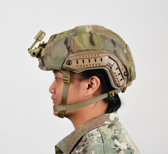 A female Soldier poses for an example photo with long hair while wearing tactical headgear to illustrate an upcoming change in Army grooming and appearance standards. The Soldier&#39;s hair is secured into a long ponytail and tucked underneath her Army Combat Uniform collar. Females with long hair will now have the option to wear a ponytail while wearing an Army Physical Fitness Uniform, conducting physical training in a utility uniform, or while wearing tactical headgear or other equipment.