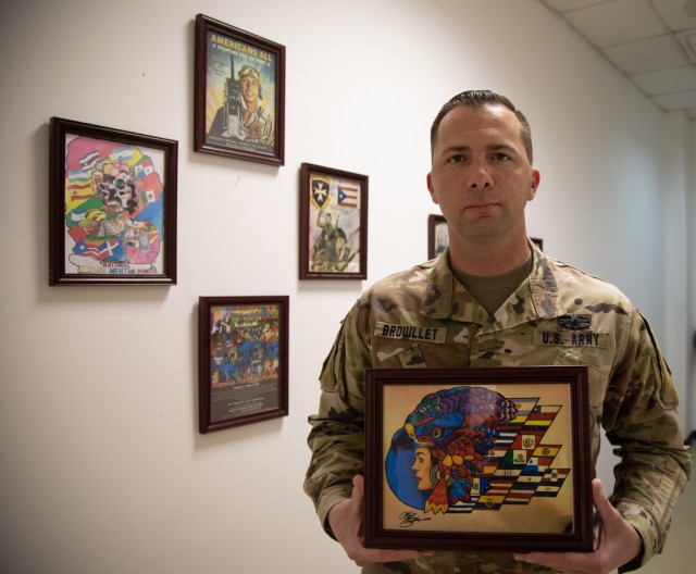 Sgt. 1st Class Brandon Brouillet, assigned to Headquarters and Headquarters Battery, 11th Air Defense Artillery Brigade, poses with his winning art work depicting Hispanic Heritage, Jan. 11, 2021, at Al Udeid Air Base. (U.S. Army photo by Staff Sgt. Mariah Jones)