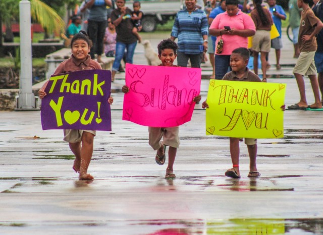 Families on the island of Kayangel, Palau, welcome U.S. service members as they conduct a low-cost low-altitude air-drop in support of Operation Christmas Drop 2020, Dec 7. The capabilities employed during OCD are unique due to the inclusion of Coastal Humanitarian Air Drop (CHAD), which incorporates the low-cost and low-altitude (LCLA) capability to the types of environments we see throughout the Pacific. CHAD and LCLA represent a unique Humanitarian Aid/Disaster Relief or wartime capability that enables crews to respond rapidly anywhere in the area of responsibility. Every effort is being made to keep all participants and recipients involved safe and healthy so we can continue to carry out this amazing tradition of humanitarian assistance.