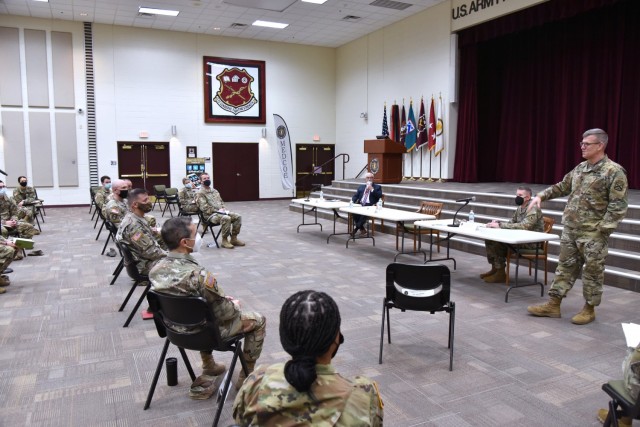 Lt. Gen. James Rainey, Commanding General, U.S. Army Combined Arms Center (CAC) and Fort Leavenworth, Kansas, addresses MEDCoE commanders and leaders while Mr. J. M. (Jay) Harmon III, SES, Deputy to the Commanding General MEDCoE, look and Command...