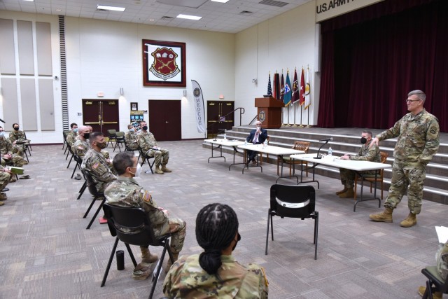 Lt. Gen. James Rainey, Commanding General, U.S. Army Combined Arms Center (CAC) and Fort Leavenworth, Kansas, addresses MEDCoE commanders and leaders while Mr. J. M. (Jay) Harmon III, SES, Deputy to the Commanding General MEDCoE, look and Command Sgt. Maj. Clark J. Charpentier, MEDCoE Command Sergeant Major, look on.