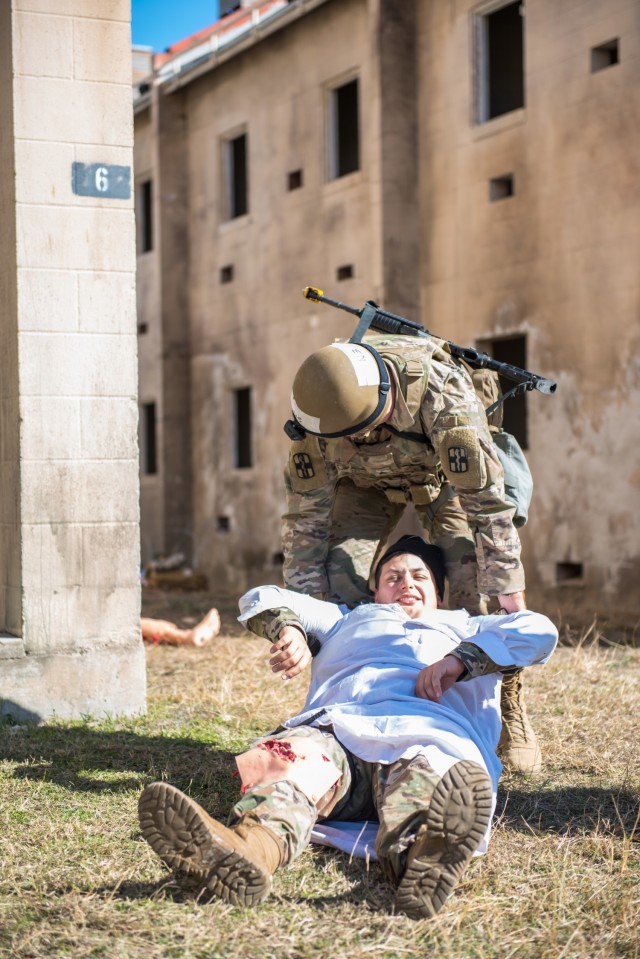 After field treatment, Sgt. Caleb Nyholm, 627th Hospital Center, drags his patient to a safe area Jan. 12 during the Soldier and NCO of the Year and Best Medic competitions.  Soldiers competed in a seven-mile ruck march, Army Warrior Tasks lanes,...