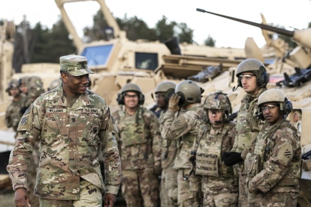 Command Sgt. Maj. Jabari Williams(Right), the senior enlisted advisor of the 2nd Armored Brigade Combat Team, 3rd Infantry Division, checks on the morale of the troops of the brigade during a troop engagement event on Bucierz Range at Drawsko...