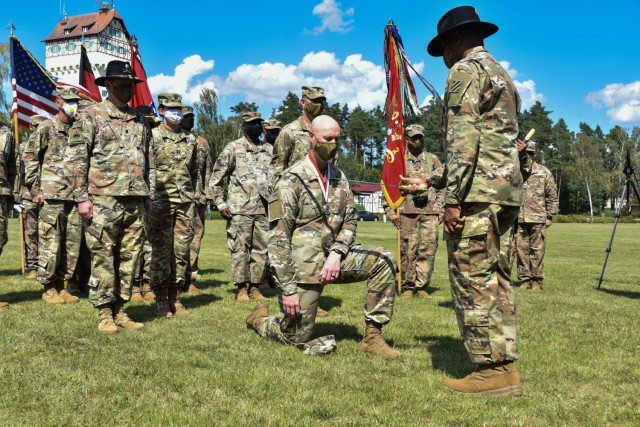 Command Sgt. Maj. Jabari O. Williams, the senior enlisted advisor of the 2nd Armored Brigade Combat Team, 3rd Infantry Division, inducts Col. Scott O’Neal, outgoing commander of the 2ABCT, to the Order of St. George on Tower Barracks Parade Field, Grafenwöhr, Germany July 20. To be inducted, among other requirements, you must be a platoon sergeant, or above, and demonstrate outstanding leadership, technical and tactical competence, and exceptional teamwork while serving specifically in Armor and Cavalry units. (U.S. Army photo by Spc. Javon Johnson/ 7th Army Training Command)