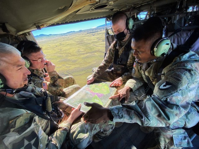 Pōhakuloa Training Area garrison commander Lt. Col. Loreto Borce briefs ASC commanding general Maj. Gen. Daniel Mitchell and 25th ID deputy commanding general Brig. Gen. Patrick Gaydon during a recon of the area. PTA is located between Mauna Loa,...