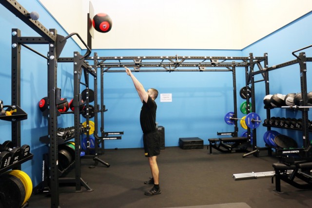 Staff Sgt. Miguel Garcia, assigned to the 311th Military Intelligence Battalion, throws a “wall ball” in the new functional fitness area of the Yano Fitness Center, Camp Zama, Japan, Jan. 21.