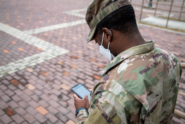 CAMP HUMPHREYS, Republic of Korea - Sgt. Jaylen Webster, a barracks manager and supply Noncommissioned Officer assigned to Headquarters and Headquarters Company, U.S. Army Garrison Humphreys, demonstrates how to access the registration for the...