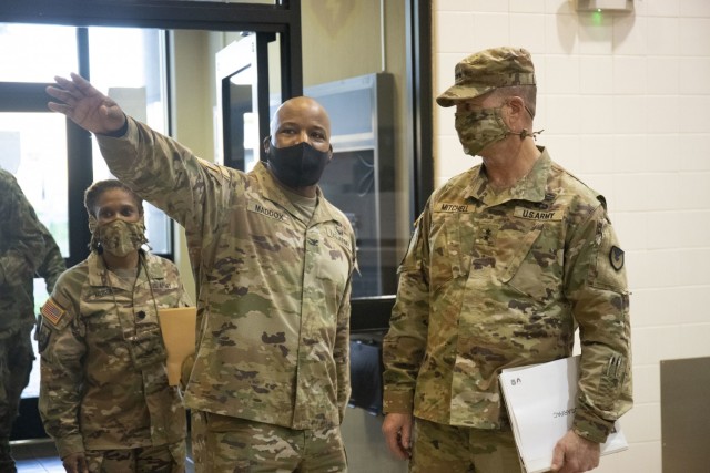 Col. Landis Maddox, commander of the 25th Division Sustainment Brigade, shows Army Sustainment Command's commanding general Maj. Gen. Daniel Mitchell the 25th ID consolidated dining facility known as the Sustainment Bistro.