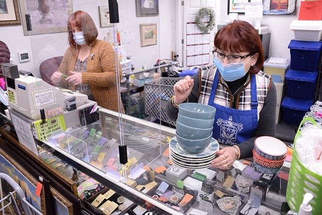 Volunteer Elizabeth Stratton and Assistant Manager Astrid Davis tally a shopper's purchase Jan. 14 at the Fort Leavenworth Thrift Shop at 1025 Sheridan Drive. The Thrift Shop provides community assistance grants annually with money earned through...