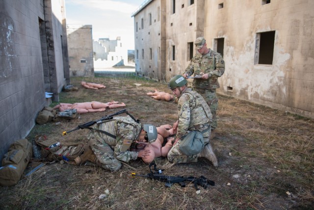 61st MMB’s Sgt. Christopher Muiruri, assesses a casualty Jan. 12.  After a grueling competition, Muiruri and his teammate, Sgt. Tyler Bisio, earned the Best Medic honors. (U.S. Army photo by Sgt. 1st Class Kelvin Ringold)