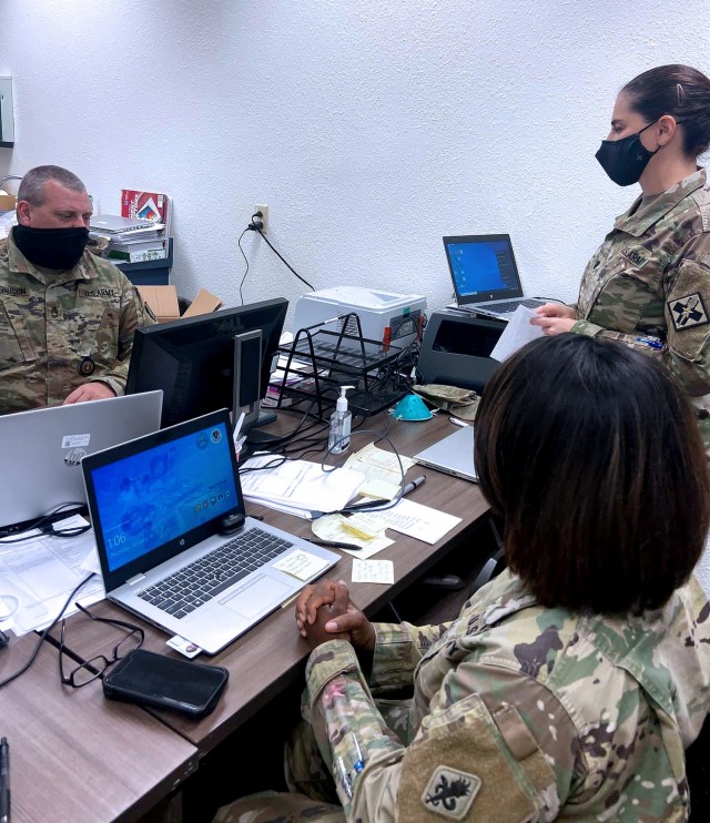 Dr. (LTC) Nadia Pearson speaks with Force Health Protection Cell teammates, SFC Christopher Magnuson(left) and MAJ Lakeisha Logan (right) in the COVID-19 Surveillance Center (CSC), MEDCoE’s new Point of Care Lab.