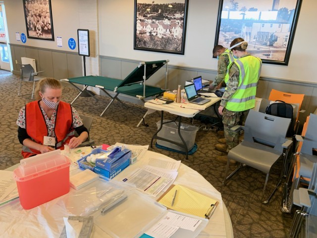 Vaccinators and Citizen-Soldiers from the Wisconsin National Guard prepare for the first day of mobile vaccination team operations Jan. 19 in Greendale, Wis. (Photo by Maj. Joe Trovato)