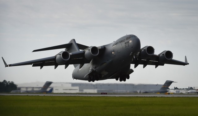A C-17 Globemaster III takes off in support of a global response force exercise at Joint Base Charleston, S.C., May 25. Twenty one C-17s were involved in the integrated large formation exercise in support of the U.S. Army's 82nd Airborne...