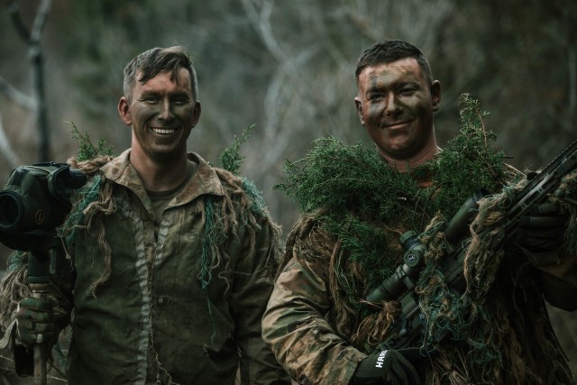 Spc. Jarrod Thomas and Cpl. Dalton Palmer, both Snipers with 1st Battalion, 12th Cavalry Regiment, 3rd Armored Brigade Combat Team, 1st Cavalry Division, pose for a photo as a two-man team after completing a successful mission during a movement, cover, and concealment training exercise, Fort Hood, Texas, Jan. 20, 2021. (U.S. Army photo by Sgt. Calab Franklin)