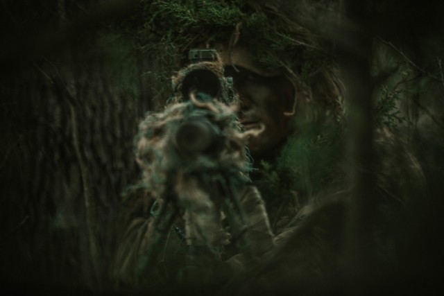 Spc. Jarrod Thomas, a Sniper with 1st Battalion, 12th Cavalry Regiment, 3rd Armored Brigade Combat Team, 1st Cavalry Division, scopes in on an enemy during a movement, cover, and concealment training exercise, Fort Hood, Texas, Jan. 20, 2021. (U.S. Army photo by Sgt. Calab Franklin)