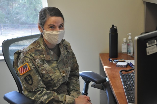Public Health Nurse Maj. Ariel Shagory works on COVID-19 contact tracing and notification in her office in the Department of Preventive Medicine at Martin Army Community Hospital.