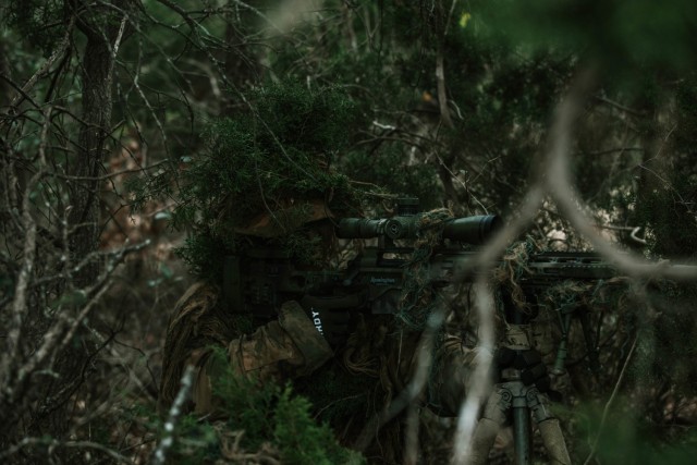 Spc. Jarrod Thomas, a Sniper with 1st Battalion, 12th Cavalry Regiment, 3rd Armored Brigade Combat Team, 1st Cavalry Division, scopes in on an enemy during a movement, cover, and concealment training exercise, Fort Hood, Texas, Jan. 20, 2021. (U.S. Army photo by Sgt. Calab Franklin)