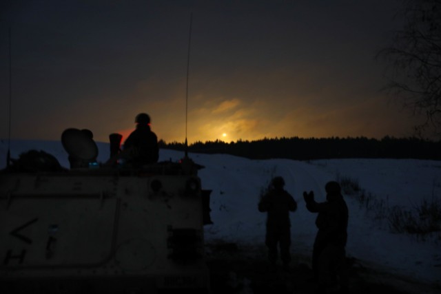 Mortarmen, assigned to Lithuanian Griffin Brigade’s 23rd Battalion, fire U.S. illumination mortar rounds Jan. 23, 2021, at the Pabrade Training Area, Lithuania. 2nd Battalion, 8th (U.S.) Cavalry Regiment mortarmen integrated the 23rd Battalion into a night fire mission in support of a section-level gunnery. The multi-national training event allowed the NATO allied force to get hands-on experience with the U.S. mortar platform and increase battlefield lethality. (Photo by Sgt. Alexandra Shea)