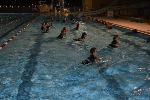 Soldier medics in training in the Gladiator program at Joint Base San Antonio Fort Sam Houston, go through morning exercises at the Fort Sam Houston aquatic center. The Gladiator program, which was initiated by the Soldiers in Training Physical Therapy Clinic on JBSA Fort Sam Houston, is designed to improve the physical readiness of Soldier medics throughout their training by identifying those who sustained an injury in Basic Training and providing additional therapy and support for them while they are in their advanced training. (U.S. Army photo by Daniel J. Calderón)