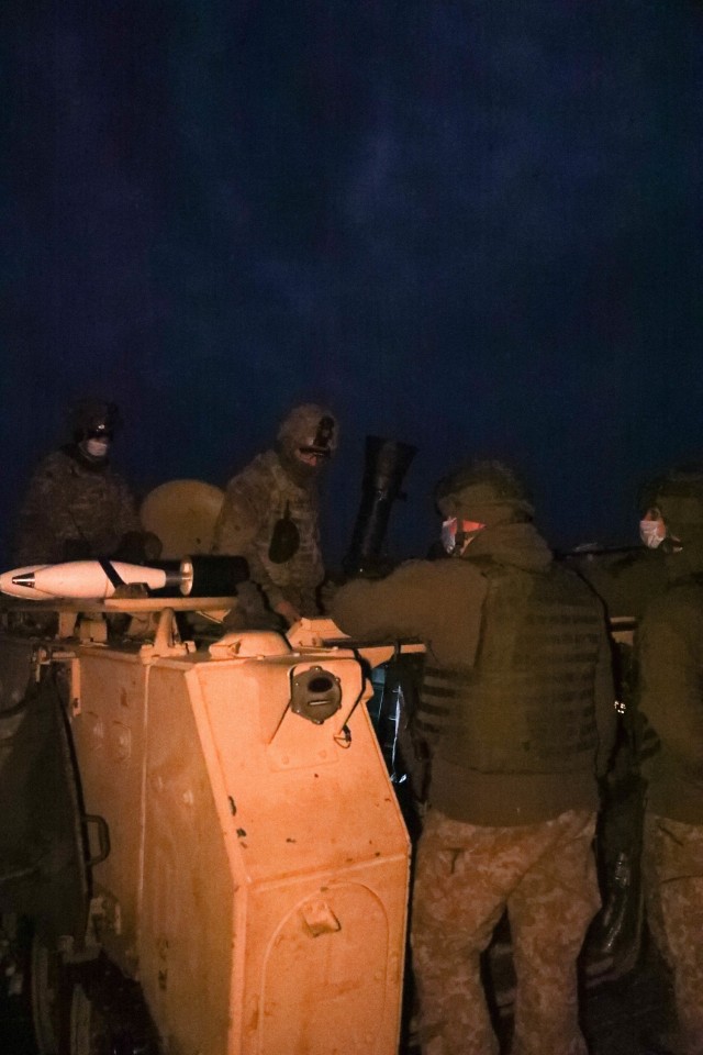 Lithuanian mortarmen assigned to Griffin Brigade’s 23rd Battalion get an in-depth introduction to 2nd Battalion, 8th (U.S.) Cavalry Regiment’s mortar weapon platform Jan. 23, 2021, at the Pabrade Training Area, Lithuania. The Lithuanian mortarmen were able to complete a night mortar fire mission to help support a section-level gunnery with illumination mortar rounds. The training established professional relationships between the mortarmen and their U.S. counterparts and increases battlefield lethality. (U.S. Army photo by Sgt. Alexandra Shea)