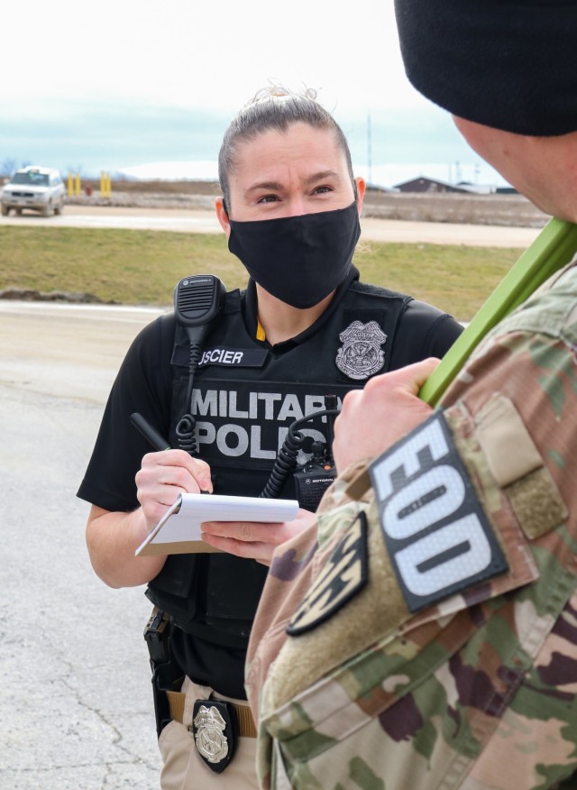 Baylee Uscier, a U.S. military police investigator assigned to Regional Command-East, Kosovo Force 28, responds to a joint force protection exercise at Camp Bondsteel, Kosovo, on Jan. 23, 2021. A mock vehicle-borne improvised explosive device was...