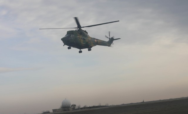 MIHAIL KOGALNICEANU, Romania – A Romanian IAR-330 Puma Helicopter positions itself to takeoff with UH-60 crews from Bravo Co., 5th Battalion, 101st Aviation Regiment to execute air assault training Jan. 20. Working together during the planning...