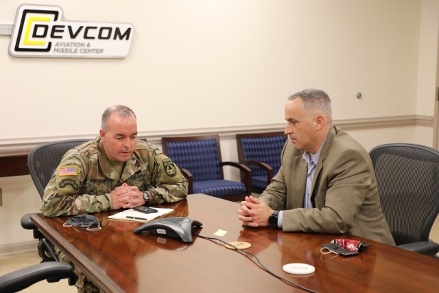 Mike Turner, right, participates in a media roundtable discussion with Long Range Precision Fires Cross-Functional Team Director Brig. Gen. John Rafferty in June 2020. 