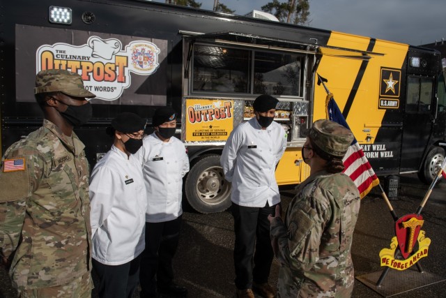 Command Sgt. Maj. Jacqueline Becerra the senior enlisted advisor for 16th Sustainment Brigade talks with Soldiers assigned to 221st Quartermaster Company, 18th Combat Sustainment Support Battalion, CSSB, about U.S. Army Garrison Bavaria's newest addition in food-service; the Culinary Outpost food truck, Jan 8.  
(U.S. Army photos by Sgt. Daniel Yeadon)